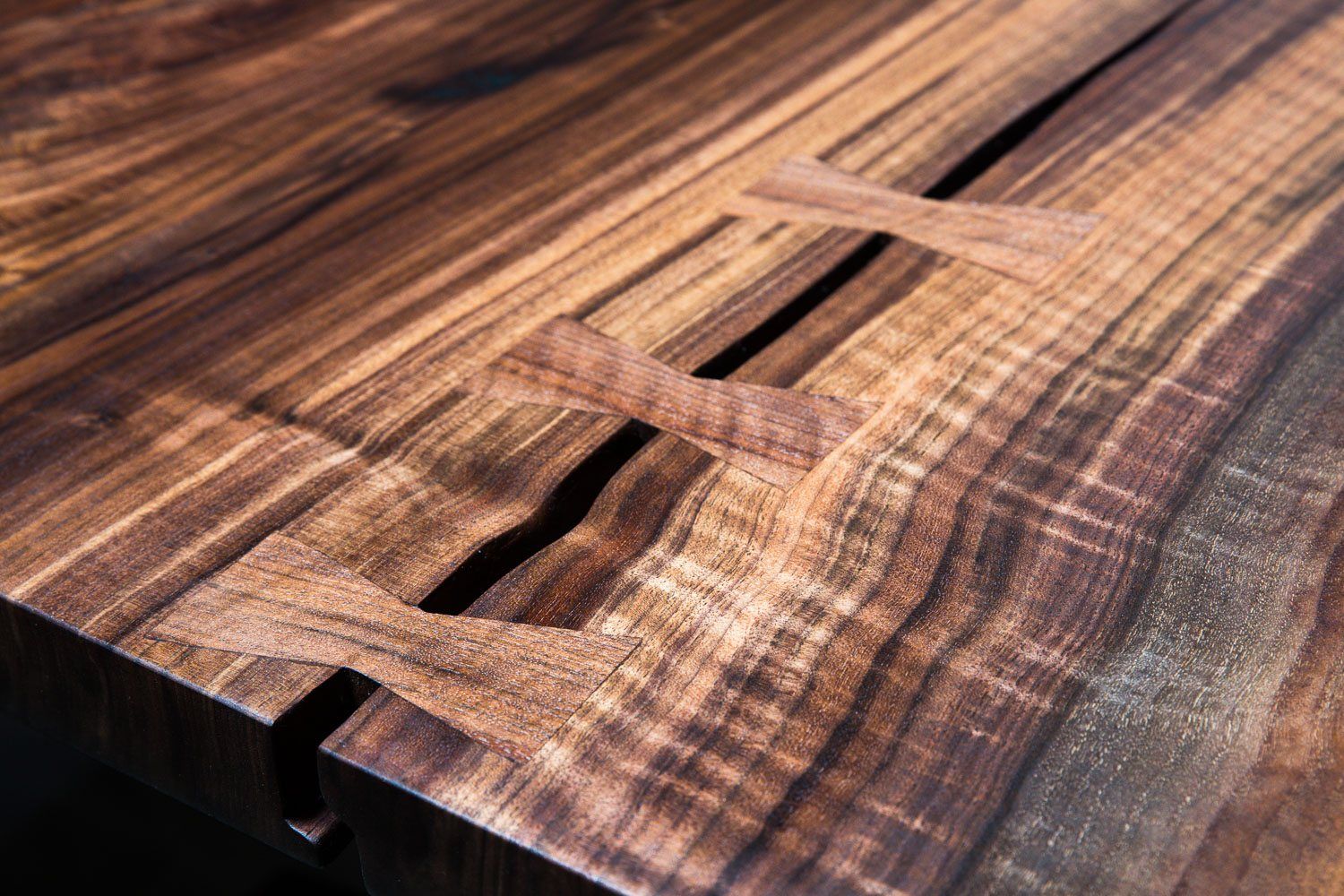 Bookmatched claro walnut slab table top with butterfly joinery, hand built by Trumanmade in Santa Cruz, California
