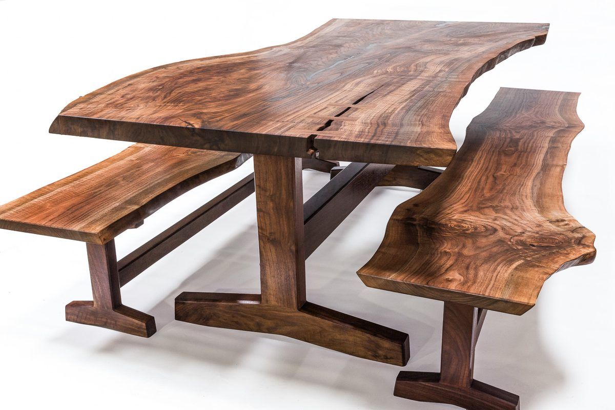 Live edge trestle dining table with two matching benches in claro walnut, available now